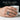 Calvary Crucifixion Ring, oxidized, worn on model hand holding a cup