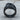 Abstract Merger Ring in black rhodium plated finish, front view on wood