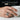 Egyptian Libra Ring, worn on model hand holding a cup