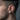 Side view of male model wearing the non-piercing oxidized silver dragon wing ear cuff around ear cartilage