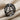 Web Dome Ring in black rhodium plated, angled view on fabric