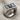 SOA Skull Ring, oxidized silver, angled front view on fabric