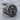 Alpha Omega Signet Ring, oxidized, angled view on wood