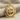 North Star Compass Pendant, gold vermeil, front view on stone block