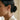 Side profile view of a woman wearing the oxidized sterling silver branch crescent moon drop earring