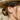 Model wearing a subtle 925 sterling silver mystic eye stud earring on earlobe with outdoor hat styling