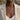 Woman wearing march birth flower necklace in oxidized silver paired with beige blazer for daily elegance