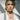 Model wearing two tone pumpkin necklace in oxidized sterling silver paired with white blazer for elegant fall style