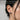 Close-up side profile view of a model wearing the handcrafted oxidized silver spider stud earring on earlobe