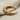Bull horn cuff earring, gold vermeil, angled view on fabric