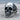 Anatomical skull jaw ring, oxidized silver, three-quarter view on wood