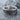 Love Is Love Ring, oxidized silver finish, resting on wet stone