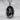 Chiseled Self-Made Man Pendant, oxidized silver, front view on stone