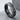Arrow Spinner Ring, oxidized, angled view on stone surface