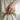 Handcrafted compass signet ring worn on a hand against beige linen outfit showcasing unisex daily wear styling