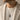 Model wearing 925 sterling silver Ouroboros tree pendant necklace with beige blazer and casual t-shirt