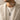 Man wearing oxidized silver archer pendant necklace with linen blazer for sophisticated daily style