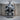 Coiled Snake Skull Pendant, oxidized, product photo on wood