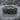 Woven rock ring, oxidized silver, angled product photo on stone