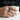 Faravahar Lapis Shoulder Ring, oxidized silver, worn on model hand holding a cup