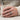 Diagonal Chisel Ring, oxidized silver, worn on model hand holding a mug
