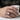 Skeleton Hands Skull Ring, oxidized silver, worn on model hand holding a cup