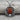 Carnelian Saddle Buckle Pendant, oxidized, angled view on rustic surface