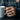 Carnelian Floret Stacking Ring, rose gold, worn on model hand holding mug