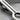 Orbit Loop Tie Clip Accessory, oxidized silver, angled close-up of open loop and clip