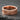 Close-up of gold plated Love Is Love pride ring highlighting the premium craftsmanship and thick band design