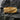 Gold variation of volcanic lava ring showing detailed crater design and polished edges