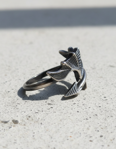 Close-up of intricate ribbed texture on handcrafted sterling silver bat wing ring
