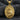 Gold vermeil Saint Clare pendant featuring monstrance detail on dark textured background