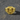 Gold vermeil ram signet ring with textured background on dark stone surface