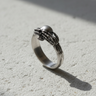 Side profile of 925 sterling silver skull ring showing detailed bone texture and oxidized finish