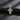 Back view of silver Orthodox cross pendant displaying engraved Cyrillic prayer text and oxidized antique finish