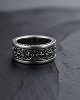 Oxidized 925 sterling silver fleur de lis ring with geometric cross pattern on black stone