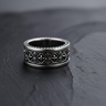 Oxidized 925 sterling silver fleur de lis ring with geometric cross pattern on black stone