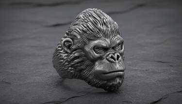 Side profile of handcrafted silver gorilla ring showing intricate ear detail and oxidized finish for depth and contrast