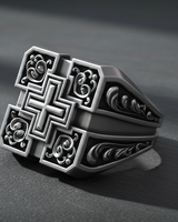 Angled view showing detailed side shank engravings and thickness of heavy handcrafted silver square cross ring