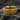 Gold vermeil gothic cross ring featuring intricate ornamental scrollwork and rope border on textured background