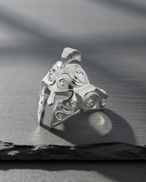 Polished 925 sterling silver Spartan helmet ring with a bright, reflective finish, angled to show design depth and shadow.