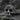 Alternative view of silver skull ring showing red stone inlay option and detailed oxidized metalwork