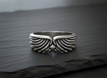 Front view of 925 sterling silver angel wing ring featuring intricate wing pattern and biker style design