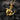Gold plated sea turtle resting on anchor pendant necklace displayed on charcoal rocks