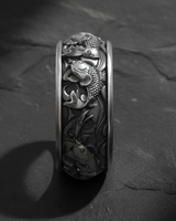 Vertical close-up of sterling silver ring showing detailed scales of koi fish and traditional wave patterns