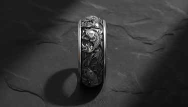Vertical close-up of sterling silver ring showing detailed scales of koi fish and traditional wave patterns