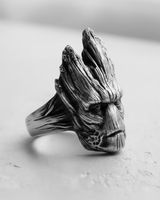 Side profile of silver tree guardian ring displaying deep wood grain texture and rugged design