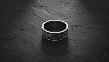 Top view of solid sterling silver band ring with oxidized Japanese landscape design and smooth interior