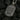 Reverse side of silver religious pendant showing engraved Cyrillic prayer and riveted edge details
